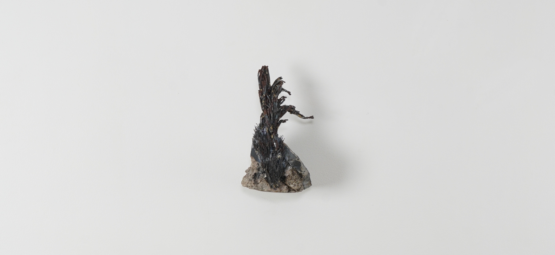 SAKSHI GUPTA,&amp;nbsp;Exposed on the Cliffs of the Heart II,&amp;nbsp;2021, rubble and metal scrap,

9.4 x 5.1 x 4.7 in / 24 x 13 x 12 cm